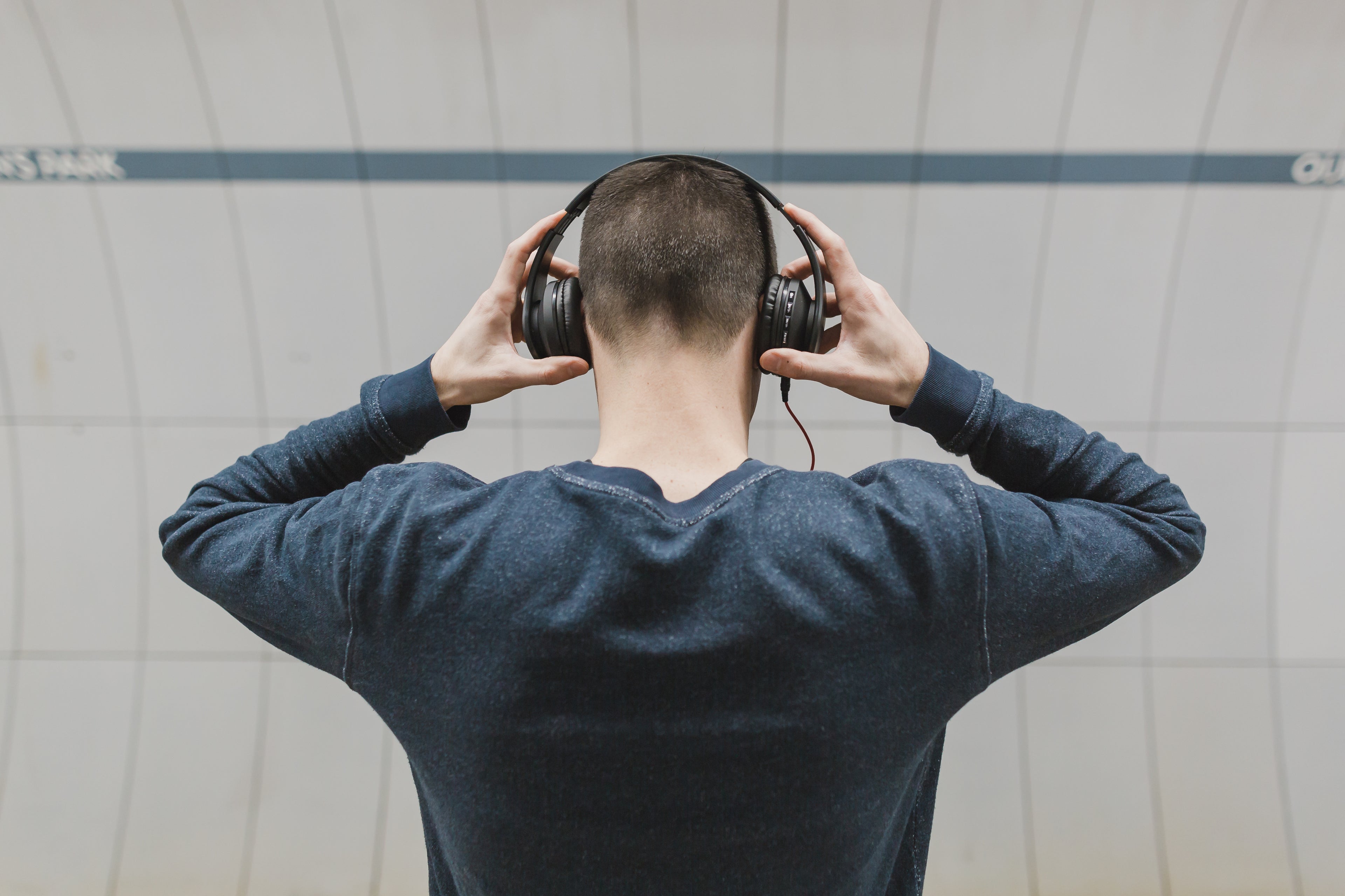 Man wearing headphones enjoying music